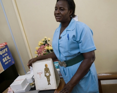 community health worker with reproductive health chart