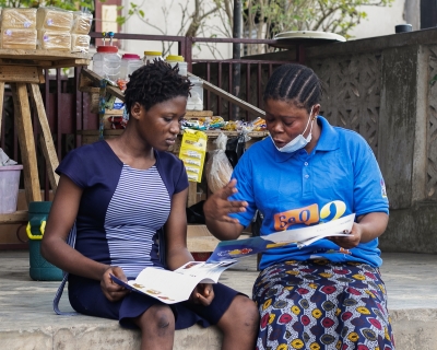 Photograph of two Nigerian women and a child.